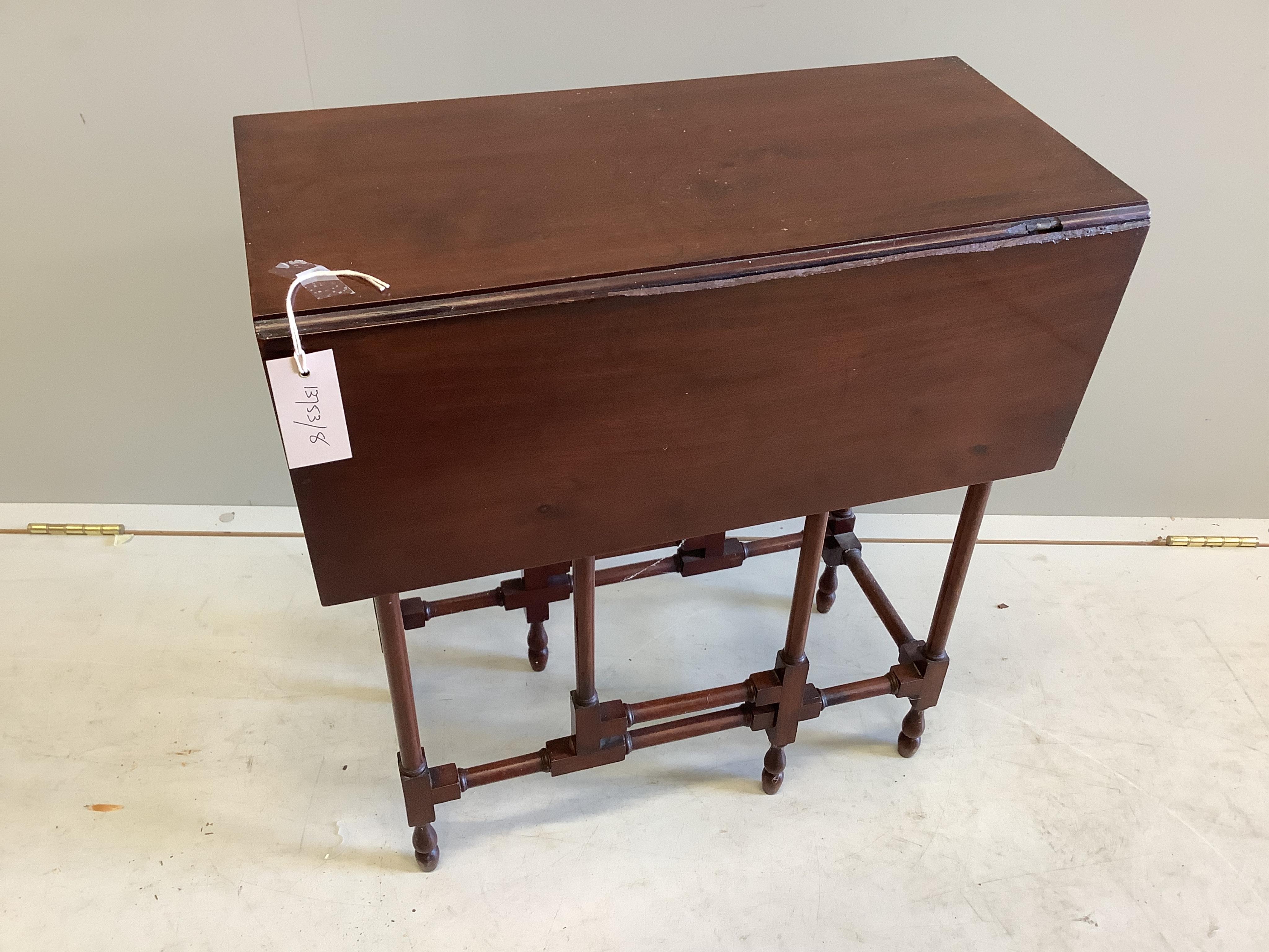 A small late Victorian mahogany Sutherland table, on spider leg supports, width 56cm, depth 27cm, height 62cm